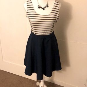Navy and white fit and flare mini dress with open back wrap design